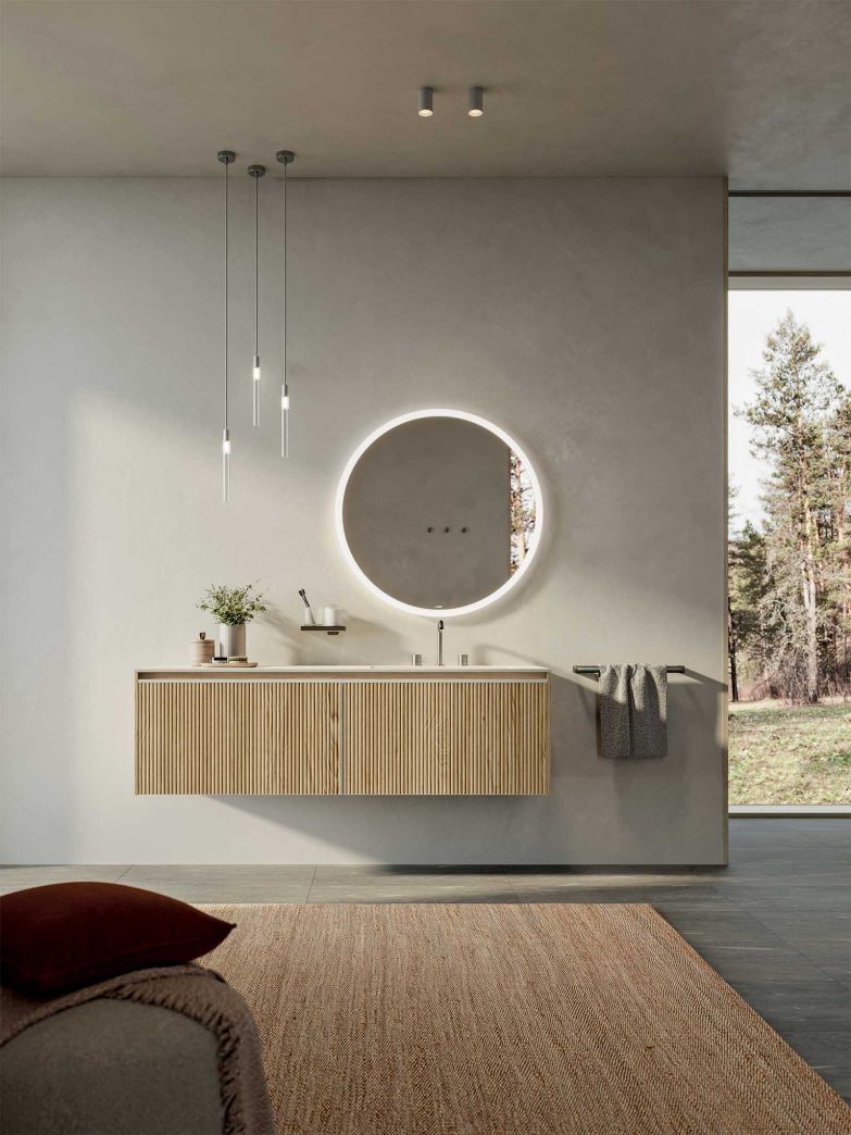 Die bestehende Badmöbelkollektion «Testadura» wird um eine Variante mit Griffmulde ergänzt. Sie ist in einer eleganten Holzausführung mit vertikalen Lamellen oder einer «gekratzten» Textur erhältlich. inda.net