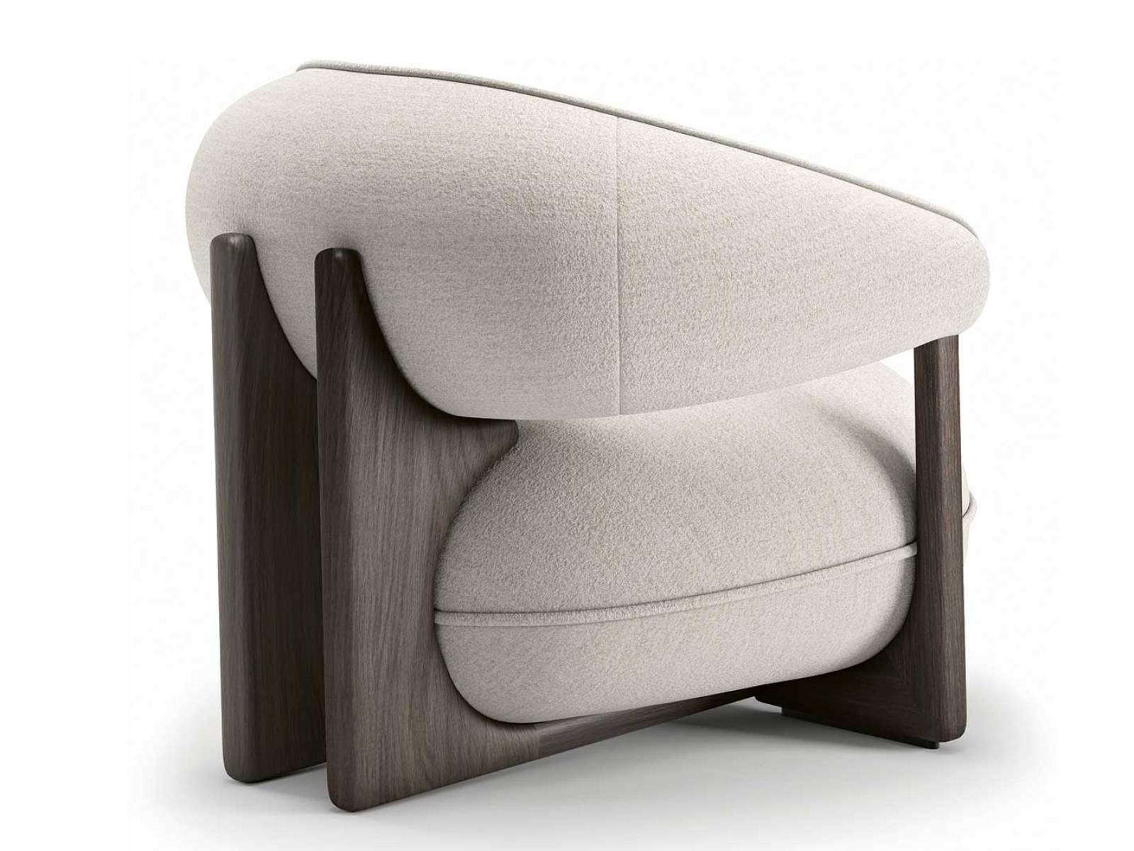 Ein Sessel mit weiter Geste, geerdet durch Holz, geprägt von den Rundungen der Siebziger: Die voluminösen Polster von «Ruby» ruhen in einer tragenden Struktur, deren weiche Konturen den Anspruch auf Komfort sichtbar werden lassen. CATTELAN ITALIA.